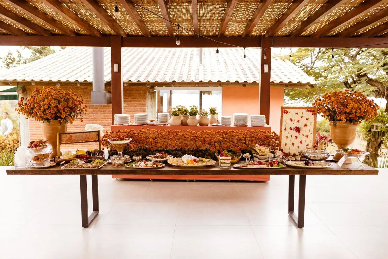 Outdoor wedding buffet with floral arrangements
